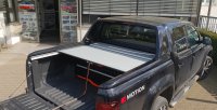 VW Amarok Aventura Double Cab from 2010  Roll-on in black aluminum retractable tonneau cover